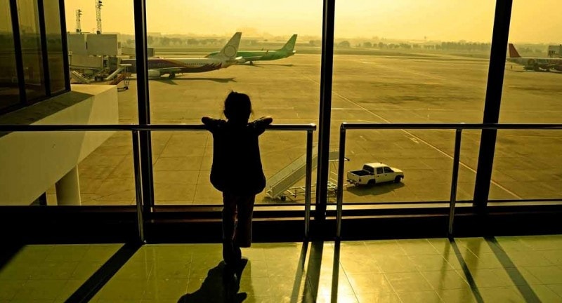 Girl looking at planes