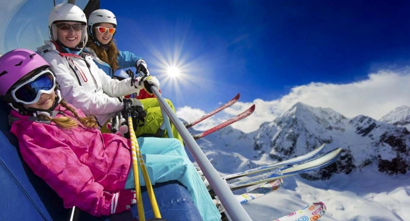 family on a ski lift