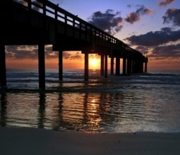 sunsets under the st augustine beach pier