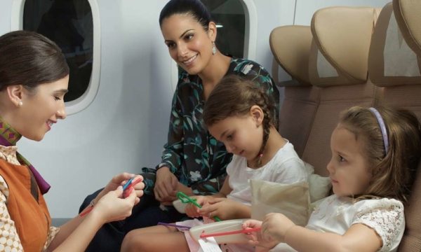 Etihad's flying nanny with two girls and their mum onboard a plane