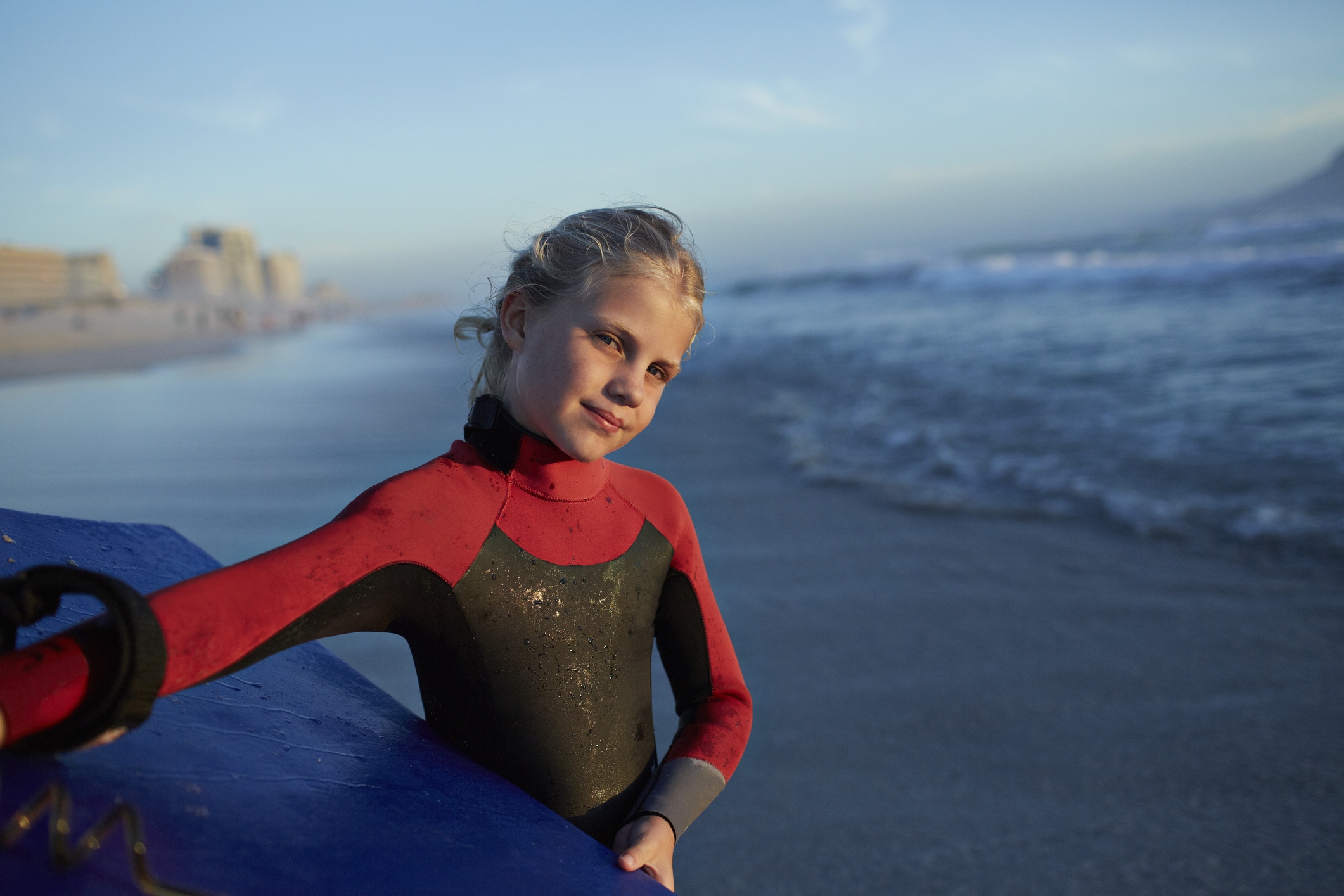 young-girl-wetsuit-surf-board
