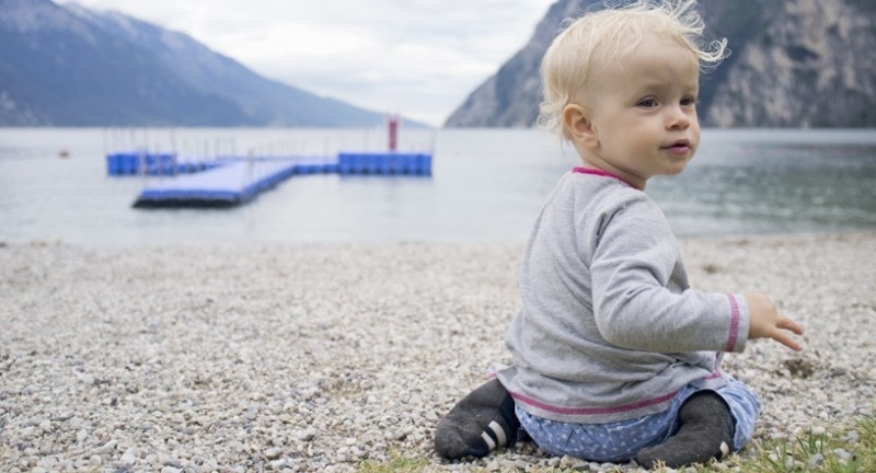 Baby sat down on lake garda