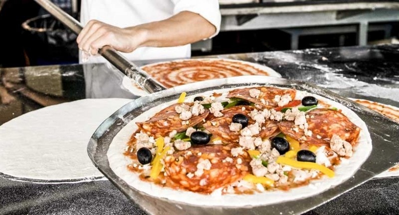 A close up of a freshly made pizza 