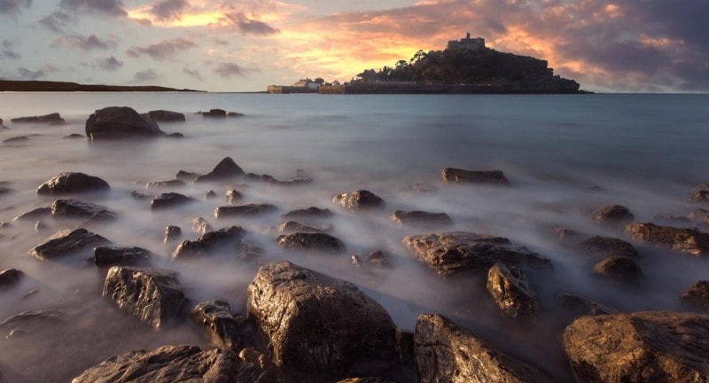 st-michaels-mount-cornwall-rising-out-of-mist-above-the-causeway-at-low-tide