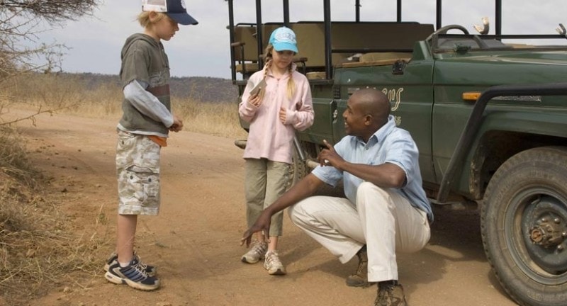 children talk to a ranger at madikwe reserve south africa
