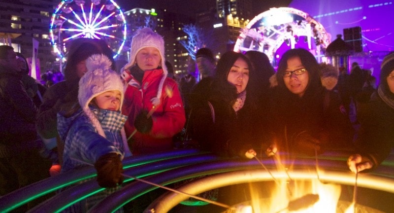 families enjoy montreal en lumiere winter festival