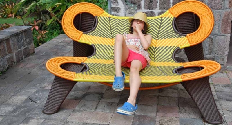 girl relaxes in chair on nevis caribbean