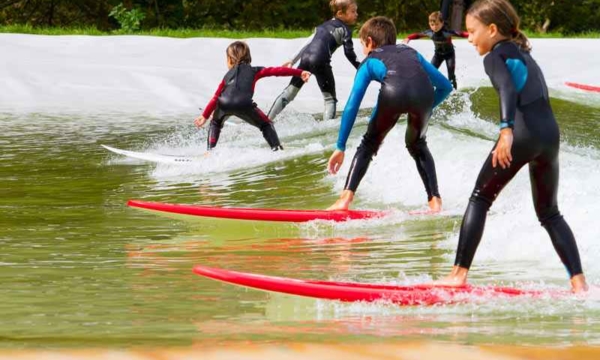group-of-young-children-surfing-in-wales