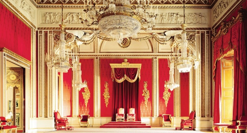 lavish red and gold bedroom in buckingham palace london
