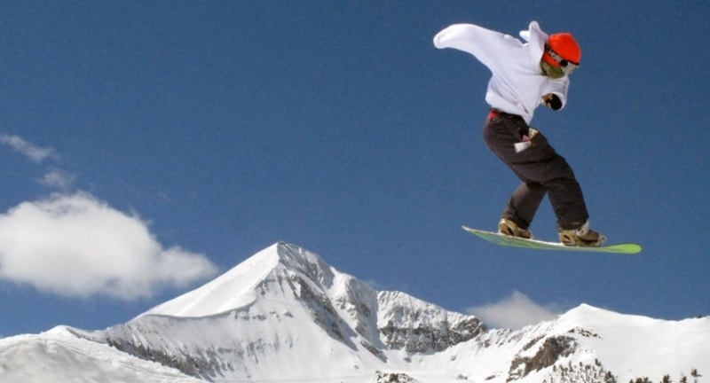 teenager snowboards at big sky montana