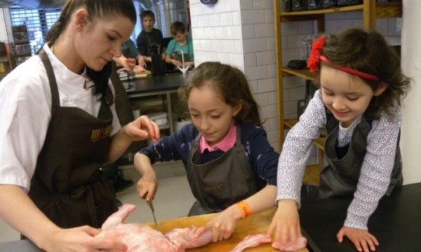 Girls taking part in a cookery lesson