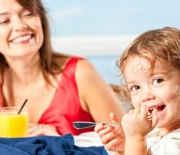 Cute-Girl-With-Fork-to-Mouth-with-Mom
