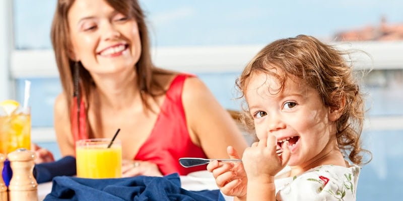 Cute-Girl-With-Fork-to-Mouth-with-Mom
