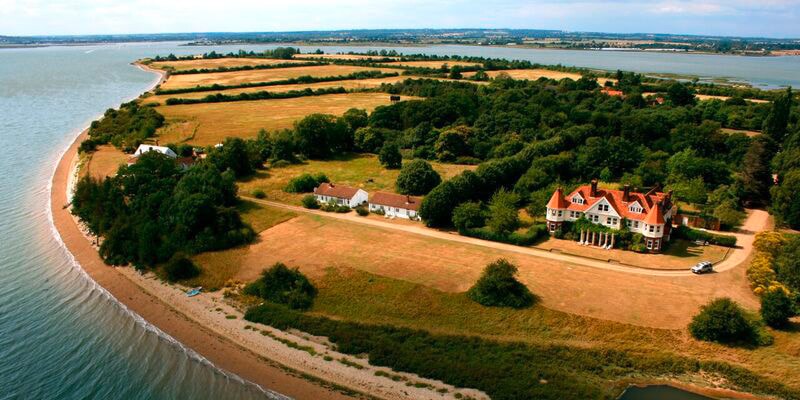 aerial-view-of-osea-island-essex-with-beach-cottages-2022