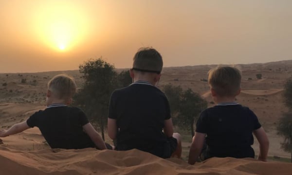 Sunset-at-Bedouin-oasis in Jebel Jais Mountains RAK with three small boys looking at the view