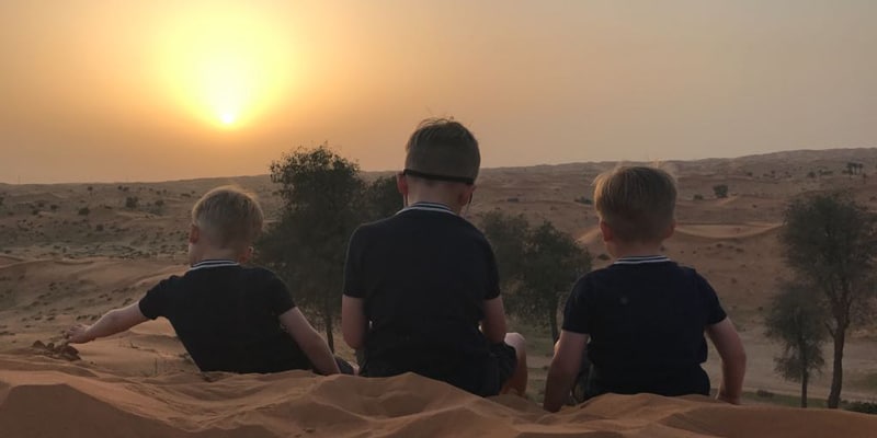Sunset-at-Bedouin-oasis in Jebel Jais Mountains RAK with three small boys looking at the view