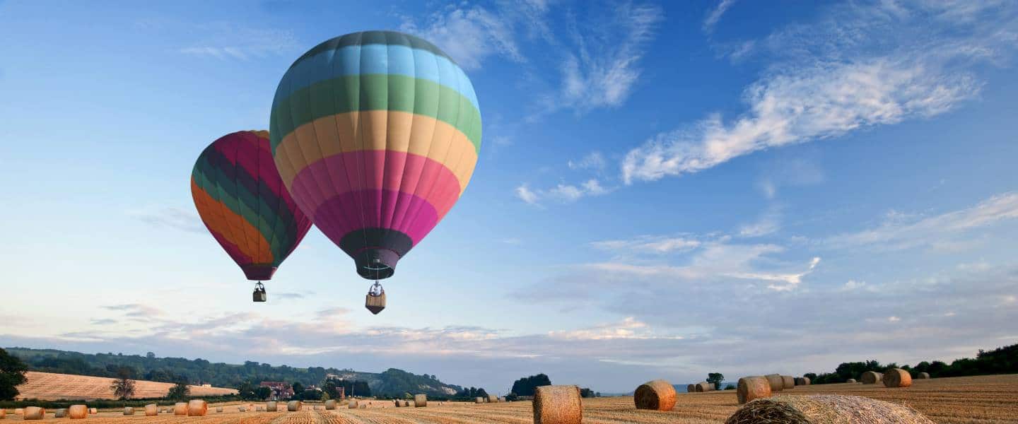 feature image hot air balloons over field in uk