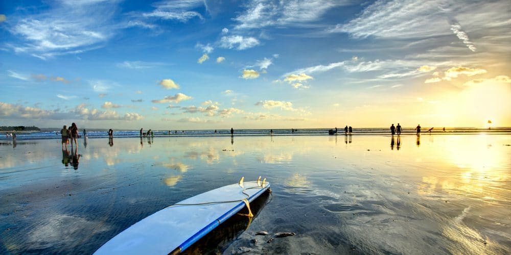 legian-beach-at-sunset-with-surfers-bali