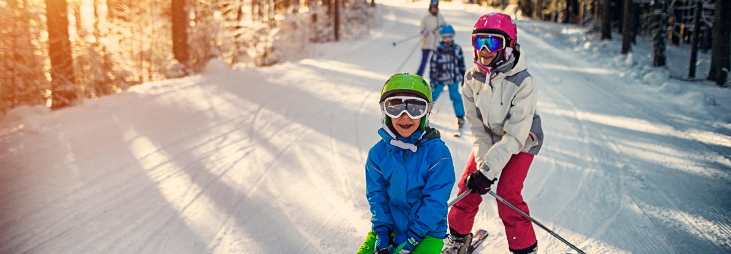 children-skiing-on-snow-feature-image