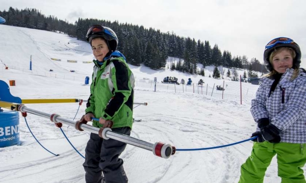 Family holiday in Austria, children skiing