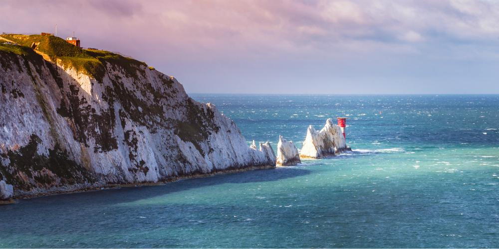 the-needles-isle-of-wight-from-alum-bay-against-a-stormy-sunny-spring-sky