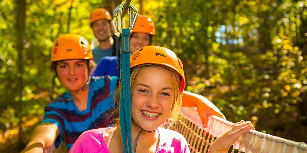 kids-ziplining-at-explorer-park-gatineau-on-family-holidays-in-ottawa-canada