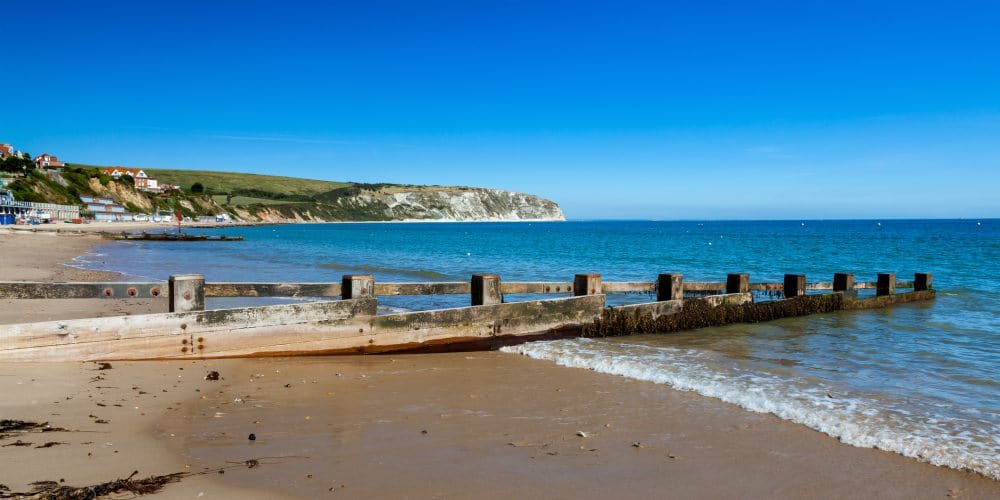 Blue sky and golden sandy beach at Swanage Dorset England UK Europe