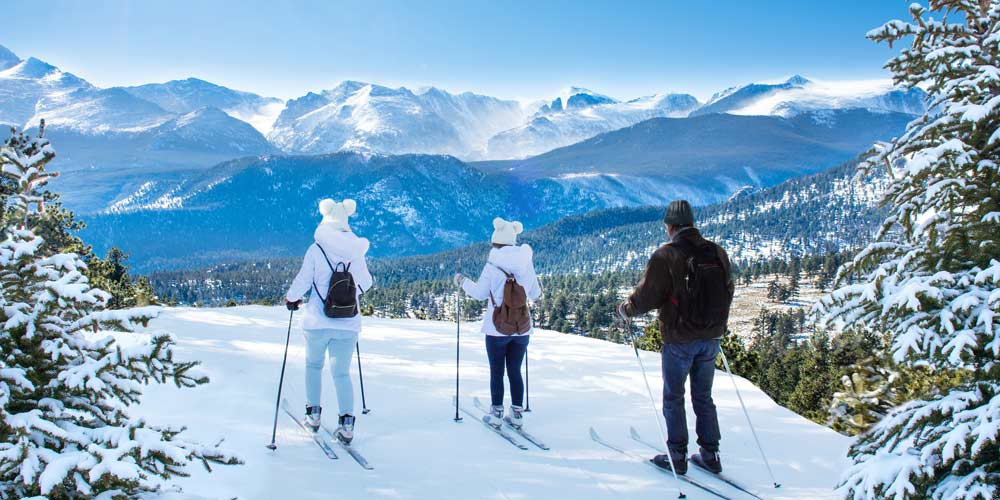 Colorado-three-people-on-mountain-skiing