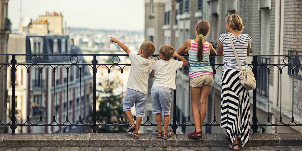 children-looking-at-view-of-paris-summer-day-family-rail-holidays-to-france